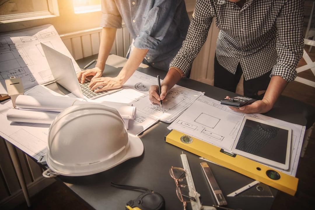Men looking at mining documents