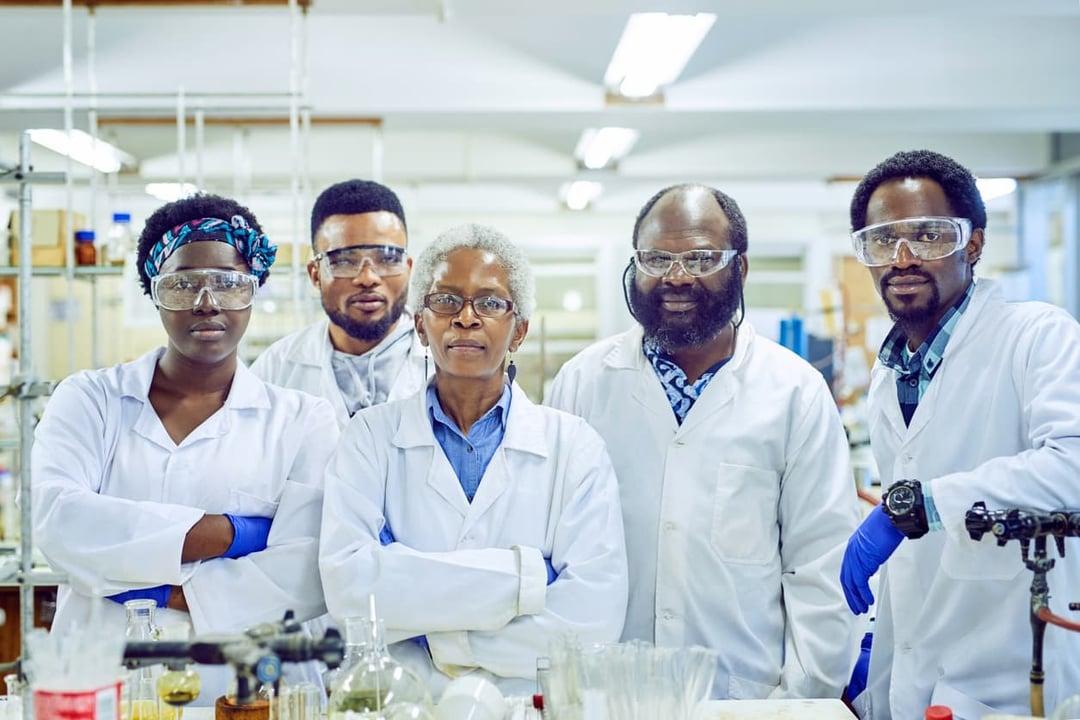 Group of pharma scientists working together in a lab Group of pharma scientists working together in a lab